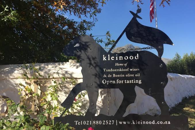 The Kleinood sheep emblem on the farm entrance sign