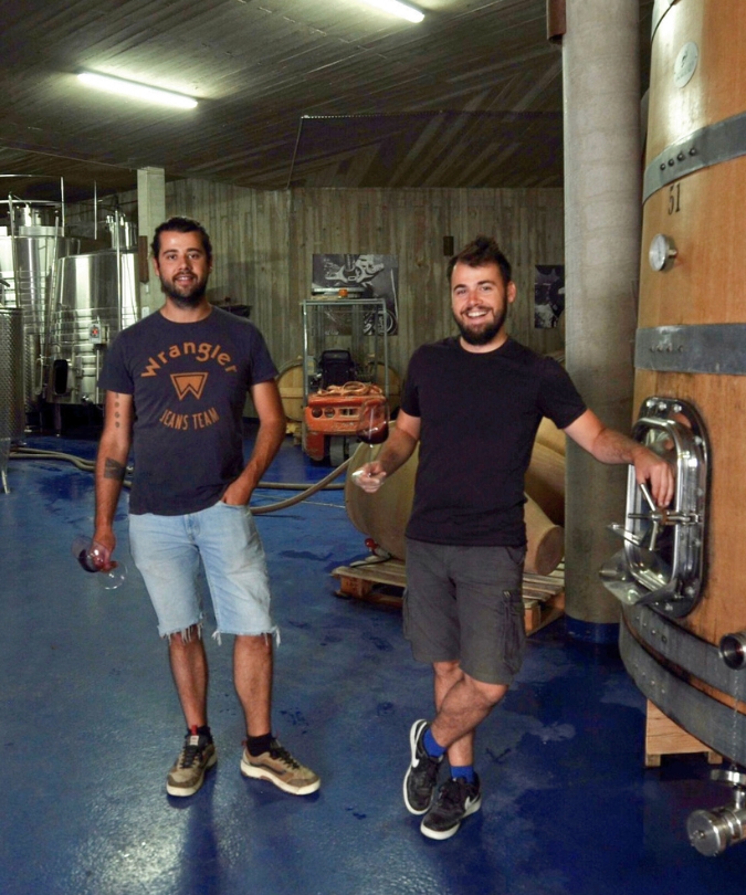 Juanjo and Carlos standing in the winery