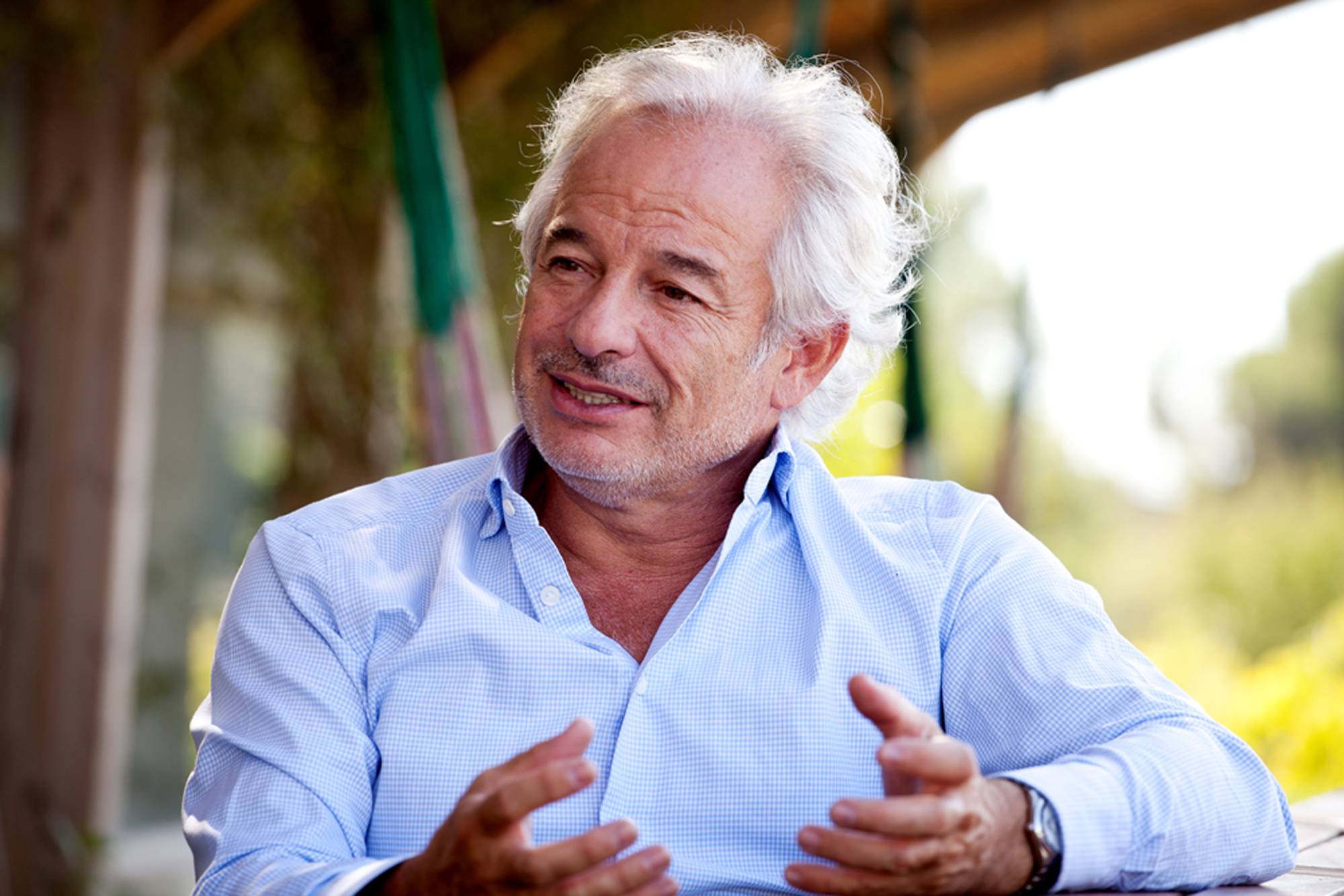 Xavier Gramona speaking with his hands while seated outdoors