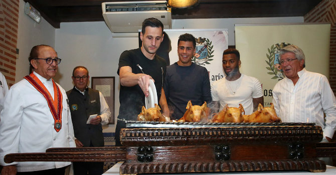 The carving of the cochinillo at a ceremony beside the restaurant's brazier