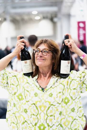 Chiara Boschis celebrating with two bottles of E. Pira e Figli